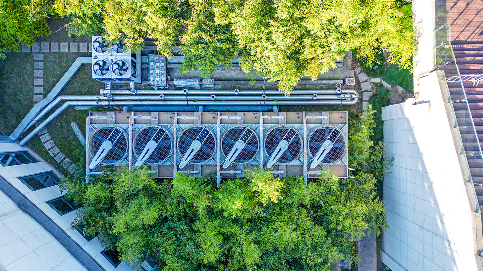 Aerial view of air conditional array in the middle of a building complex.