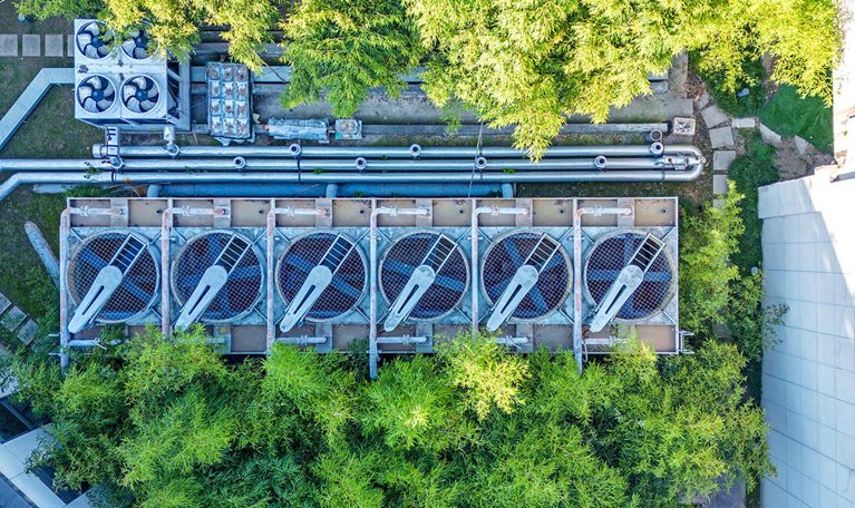 Aerial view of air conditional array in the middle of a building complex.