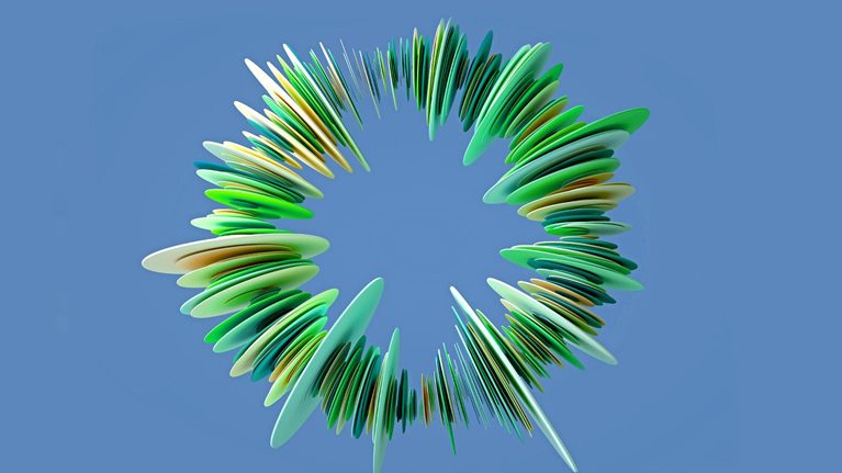 An abstract ring-like structure composed of many green, yellow, and blue layered, petal-shaped elements. It has a sense of depth and is set against a solid blue background.