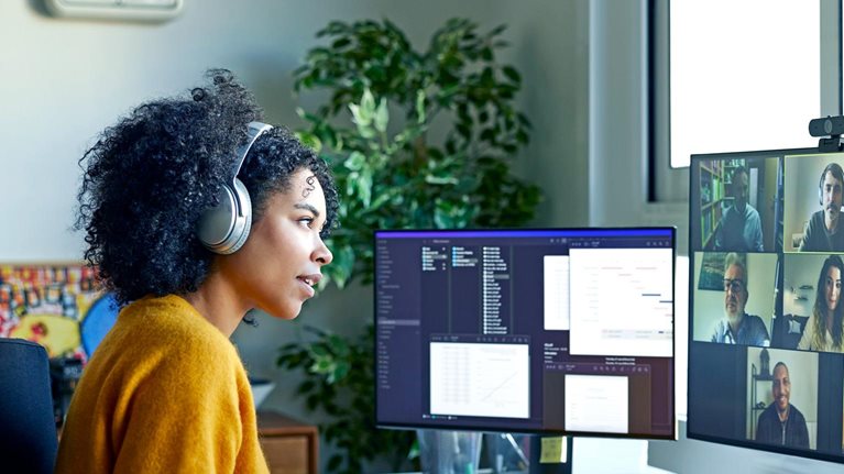 Businesswoman with headphones on a video conference